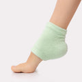 Voesh moisturizing heel sock on a model.