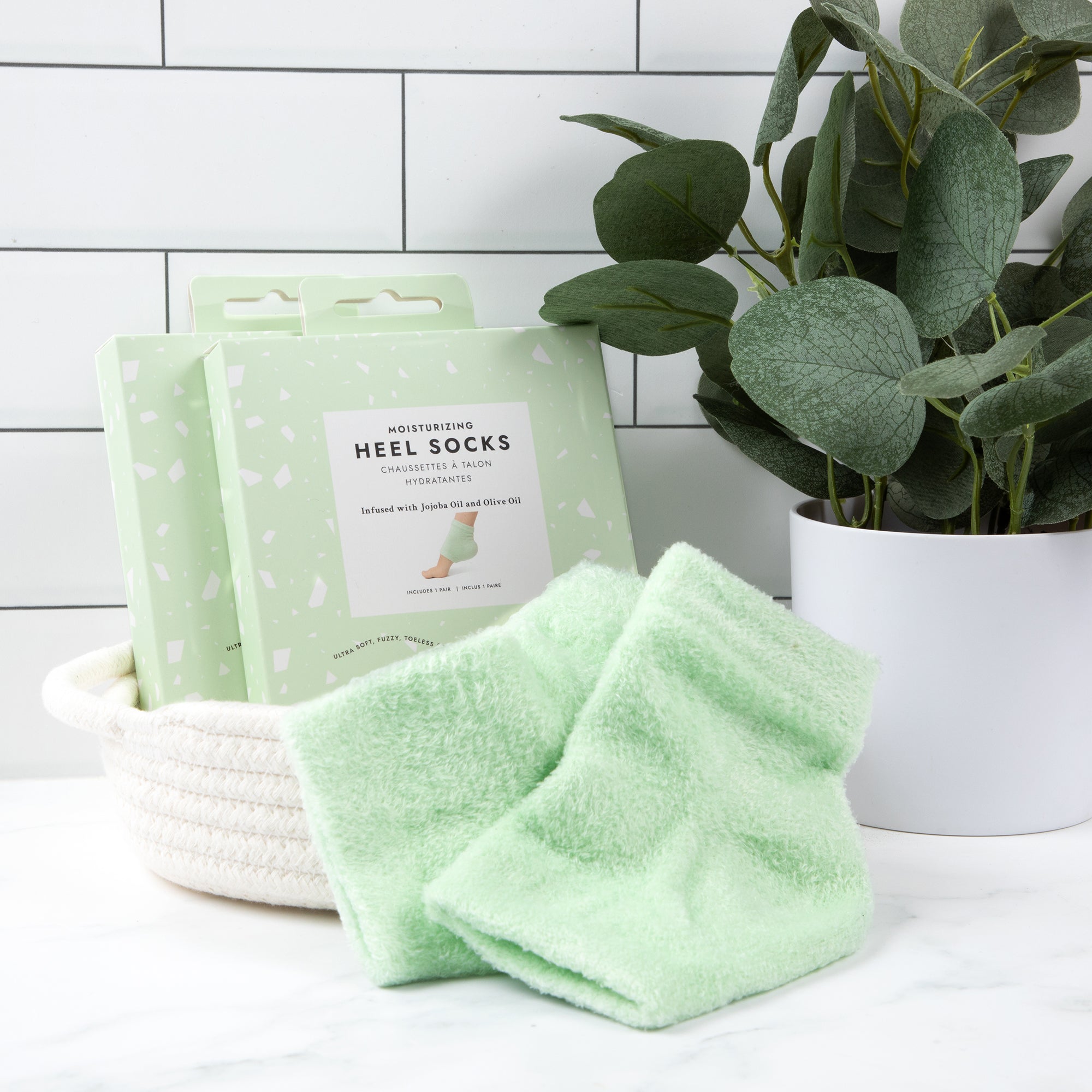 Voesh moisturizing heel sock on a counter with packaging.