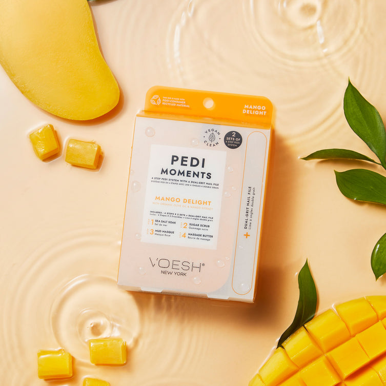 Pedi Moments Mango Delight on an orange water background with sliced mangoes.