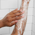 closeup of woman's arm with sugar scrub
