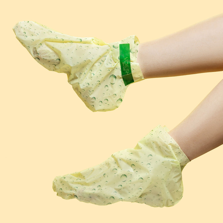 A pair of feet wearing VOESH Refreshing Odor Treatment Socks