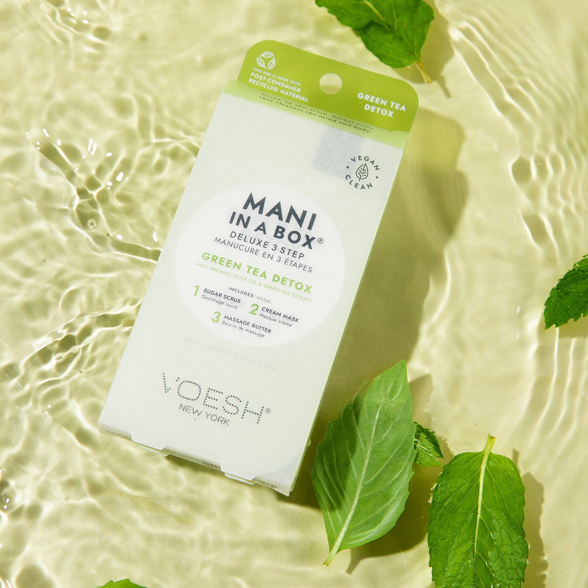 voesh mani in a box green tea detox sitting in water with leaves