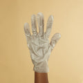 Woman wearing collagen gloves