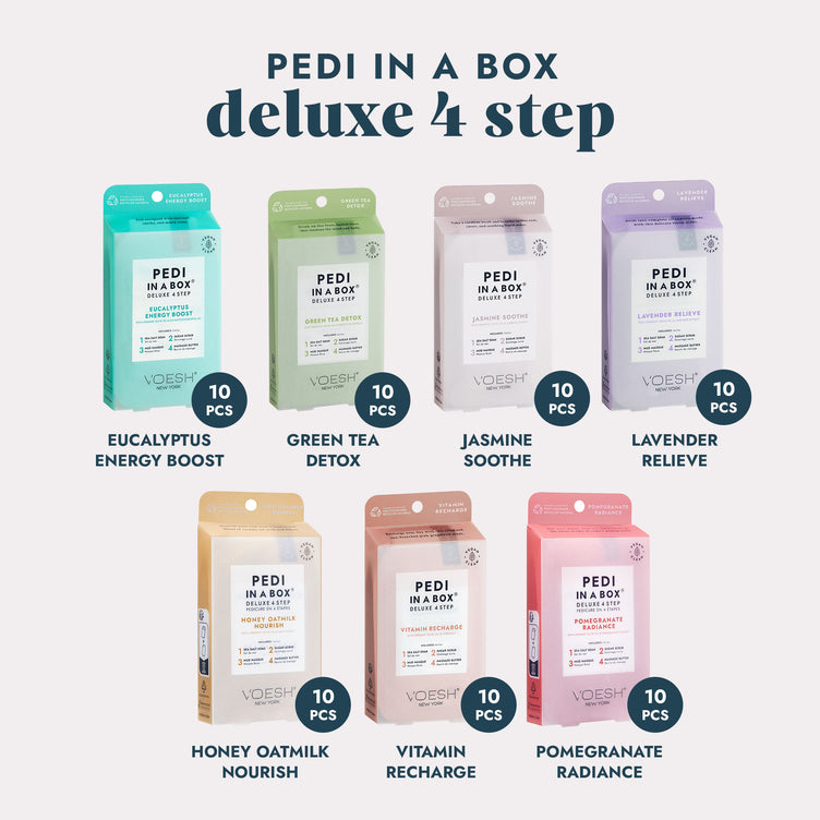  7 Pedi in a Box Deluxe 4 Step kits in various scents on a gray background.
