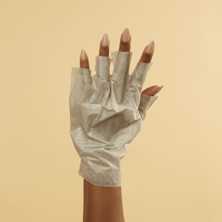 Woman wearing collagen gloves with perforated tips removed