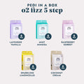 5 Pedi in a Box O2 Fizz 5 Step kits in a variety of scents on a gray background.