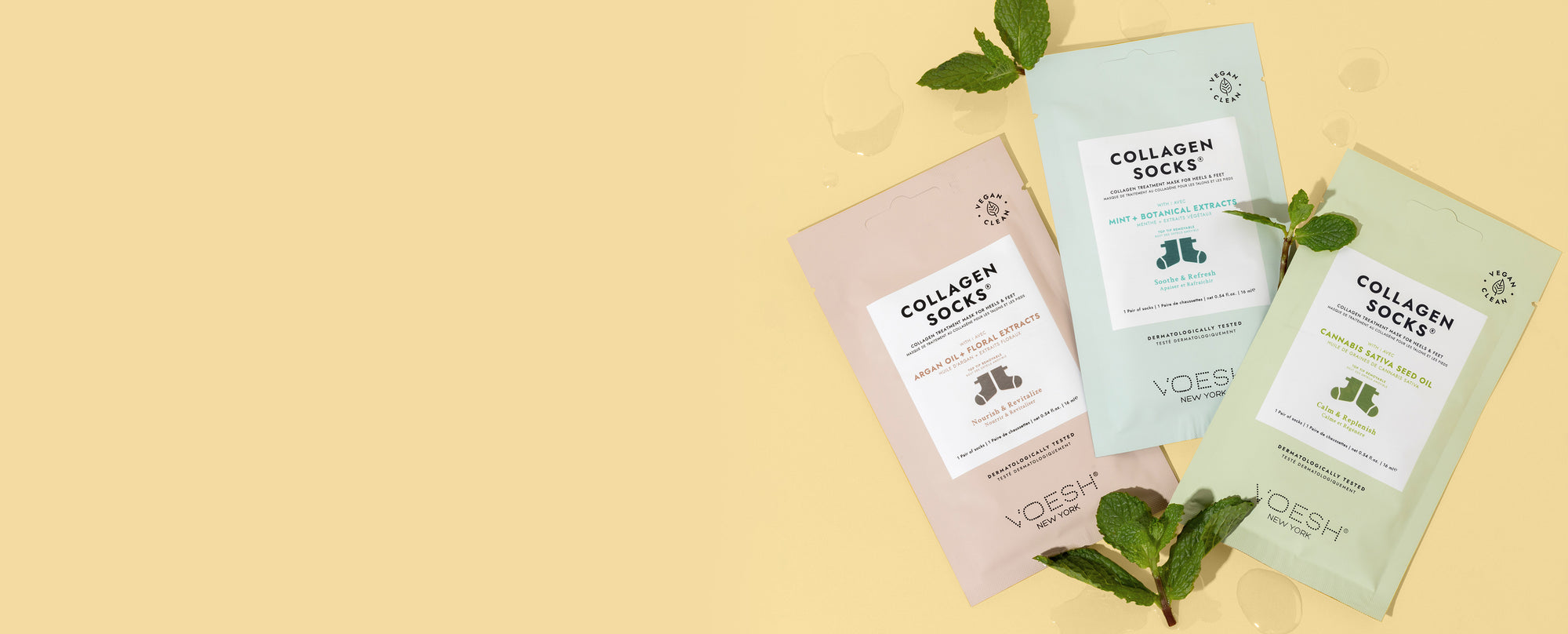 Collagen Socks Argan Oil + Floral Extracts, Collagen Socks Mint + Botanical Extracts, and Collagen Socks Cannabis Sativa Seed Oil on a yellow background with mint leaves. 