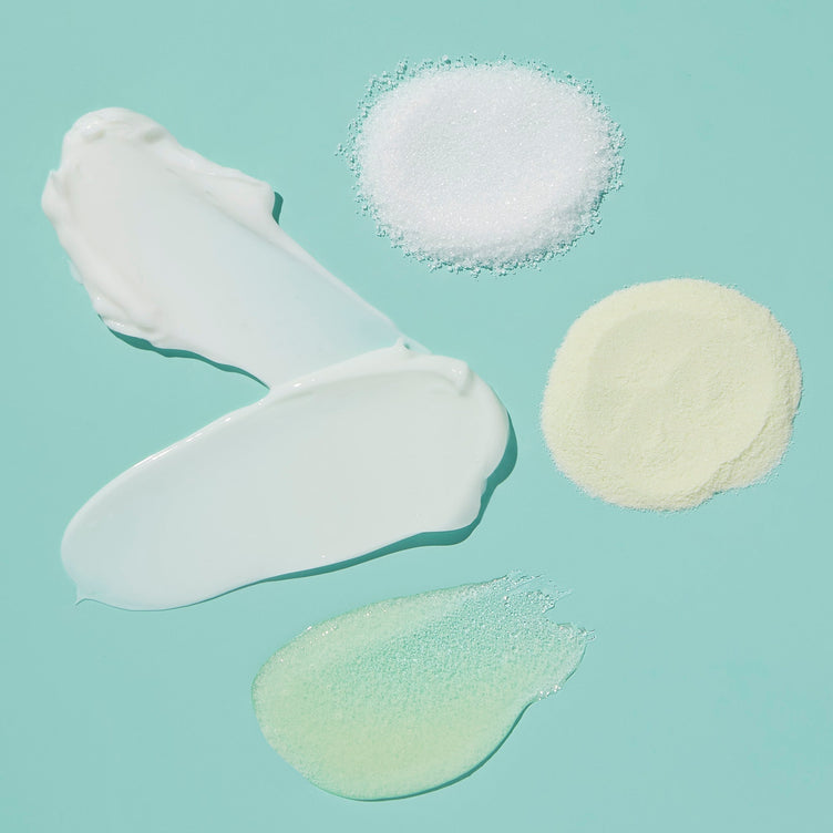 Product texture of Fizz powder, Salt, Scrub Mud masque, Massage butter on blue background