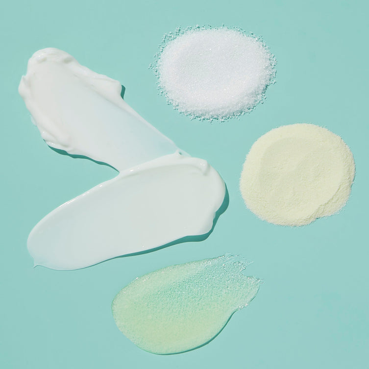 Product texture of Fizz powder, Salt, Scrub Mud masque, Massage butter on blue background