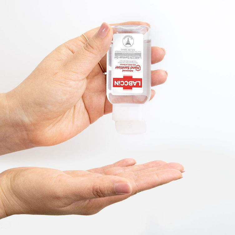 Woman squeezing hand sanitizer onto hand