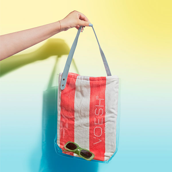 Voesh clear beach tote featuring beach towel and sunglasses