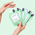 aloe aloe pedi in a box 6 step packets being held by woman's hand on light green background
