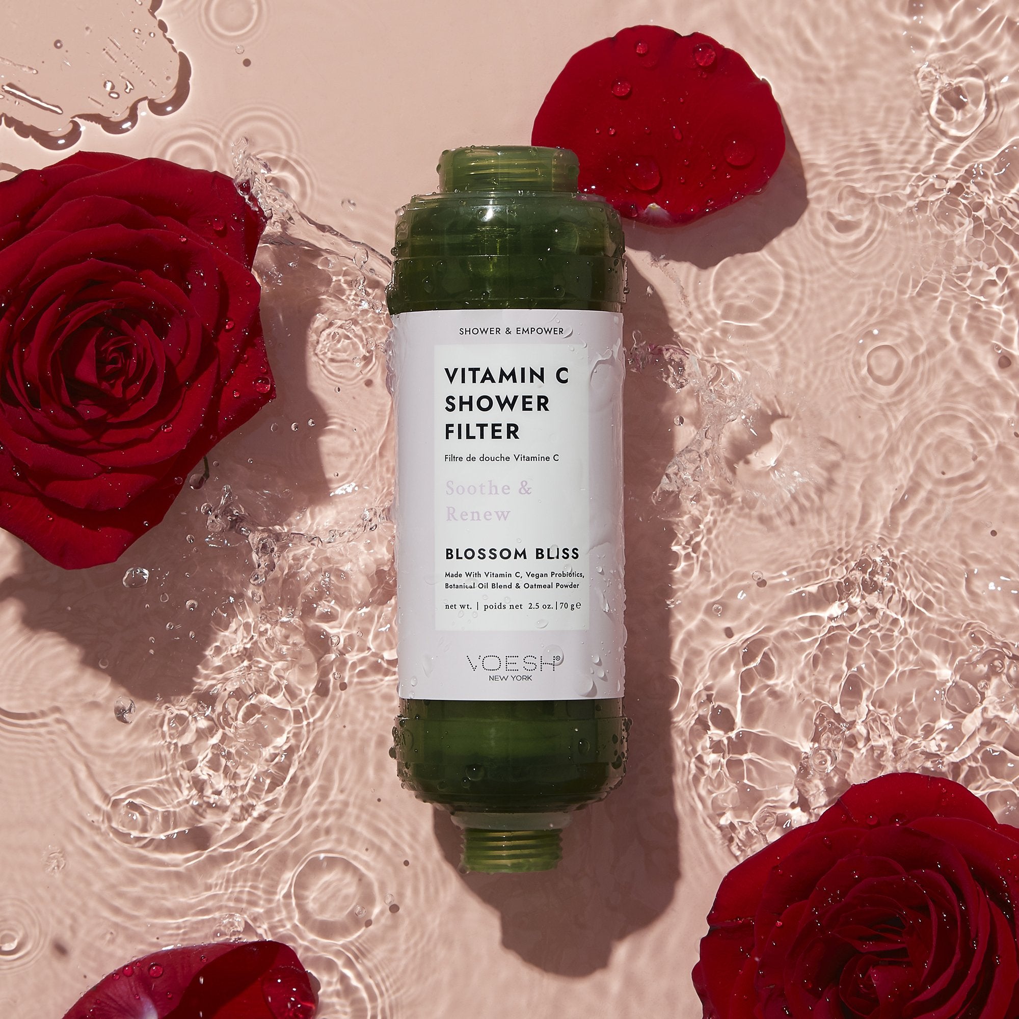 Vitamin C Shower filter on water surrounded by Roses