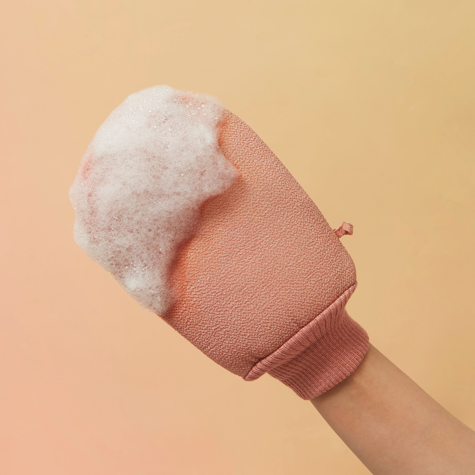 Woman wearing loofah back side