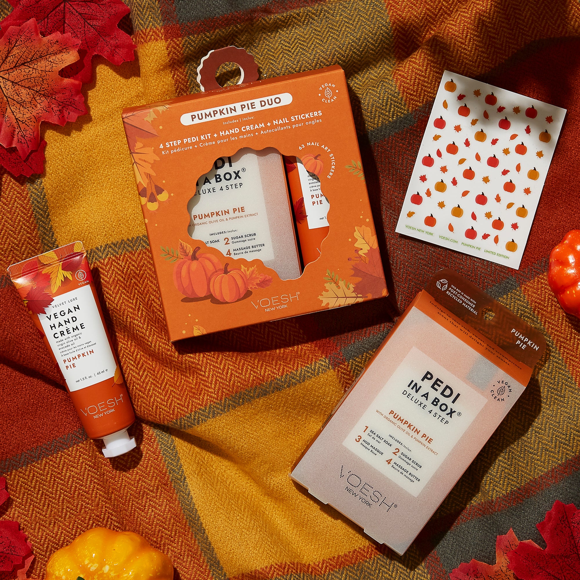 Pumpkin Pie Duo Box, Pumpkin Pie Pedi in a Box 4 Step, Vegan Hand Creme, and Nail Stickers on Plaid Fall Blanket