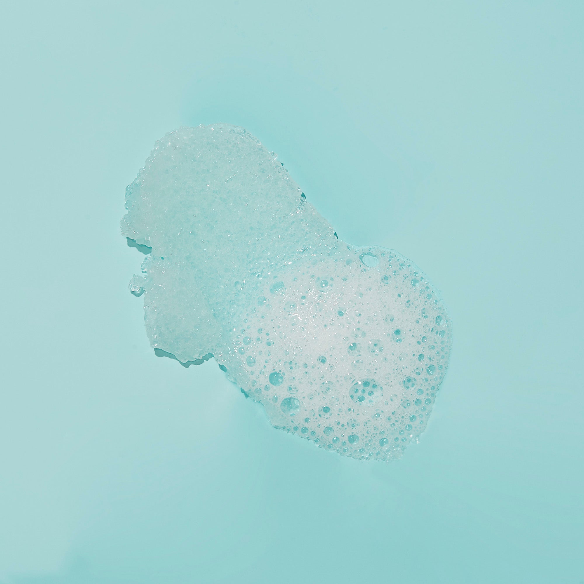 Texture of sugar scrub with bubble on blue background